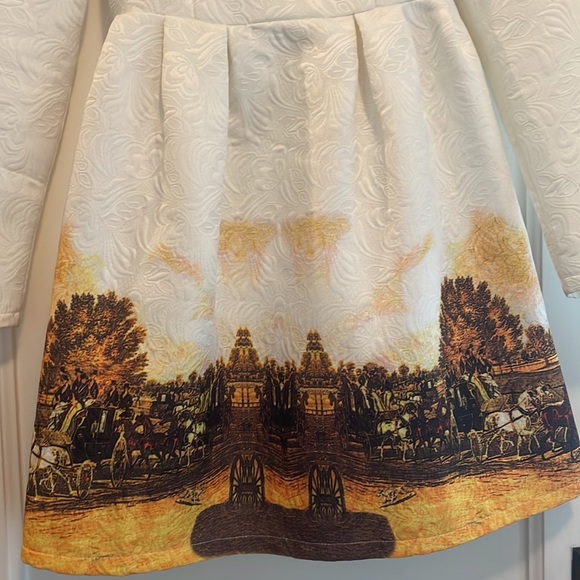 White mini long sleeved dress with horse and carriage details at the bottom - Picture 2 of 5